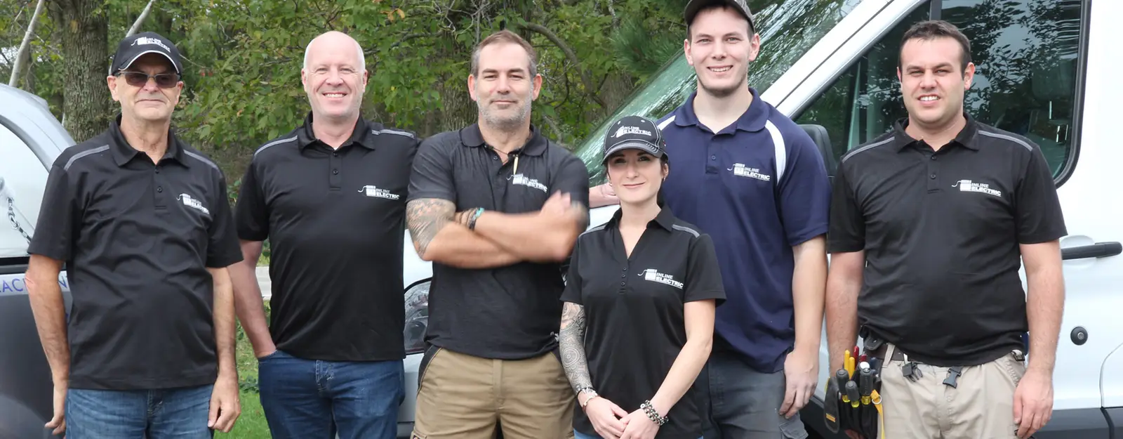 The Inline Electric team standing together on a job site