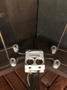 Knob and tube junction box with porcelain insulators — is this wiring still safe in your home?