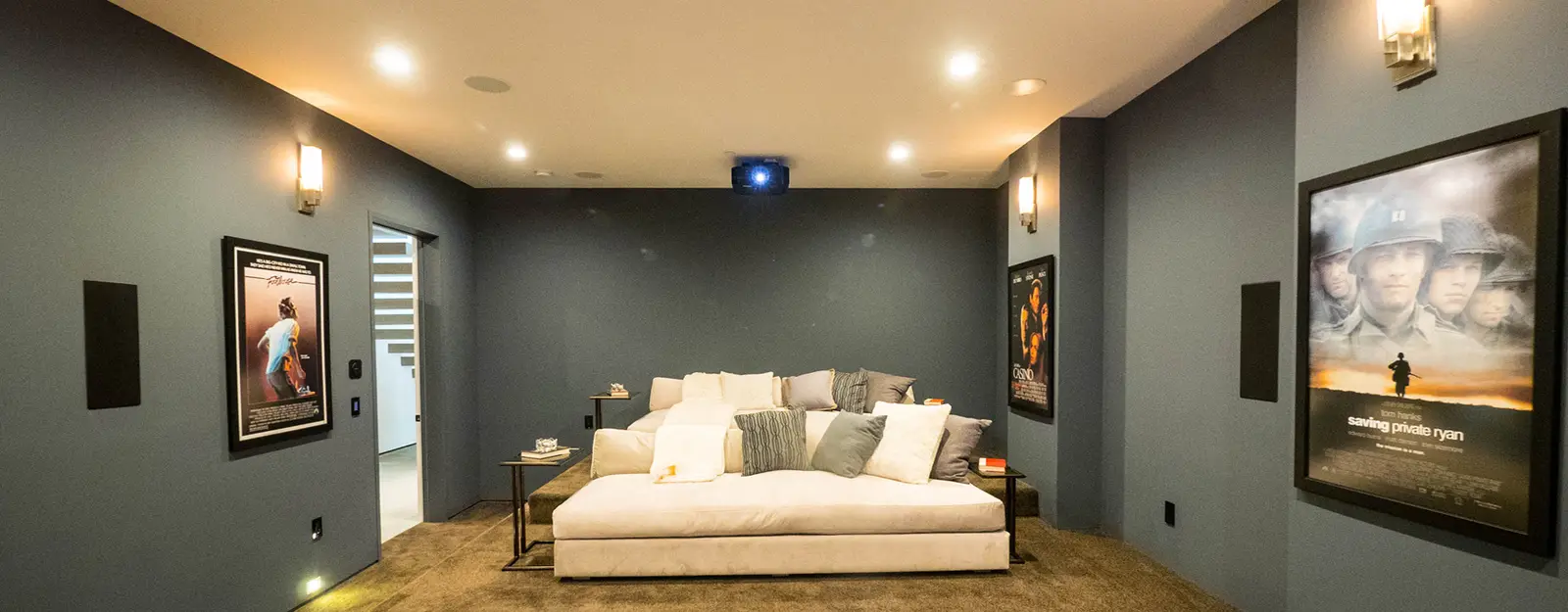 Basement home theatre with recessed pot lights and wall sconces installed by Inline Electric in Kitchener-Waterloo